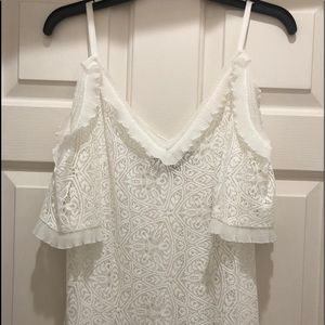Ivory lace cold-shoulder top with ruffled accents
